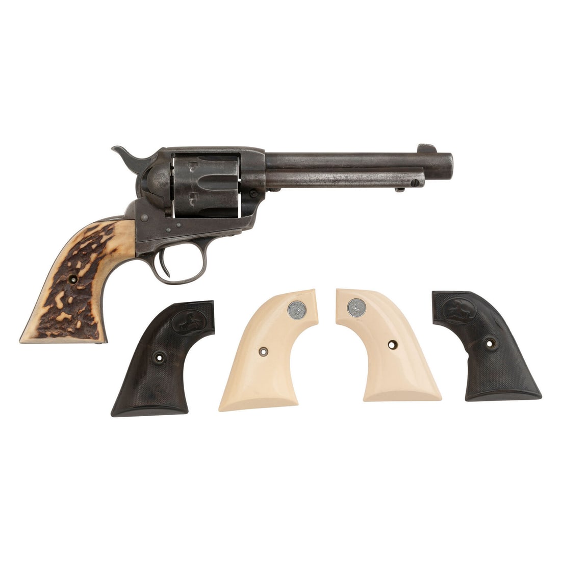 **Colt Single Action Army Revolver with Extra Grips: **Colt Single Action Army Revolver with Extra Grips .38-40. 5.5" barrel. SN: 307613 (mfg. ca. 1908) Trace of blued finish transitioning to brown patina overall with staghorn grips, and further accompa