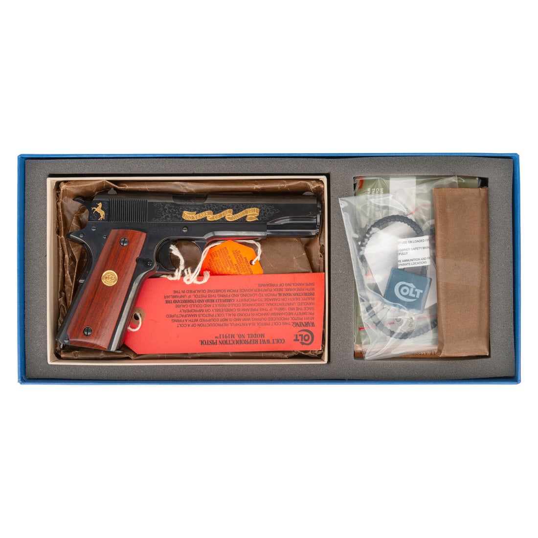 *Boxed Colt 1911 100 Year Commemorative Government Model Tier II Pistol: *Boxed Colt 1911 100 Year Commemorative Government Model Tier II Pistol .45 ACP. 5" barrel length. SN: 19110563. Polished blued metal finish mounting smooth wood grips sporting C100 gold medallions. S