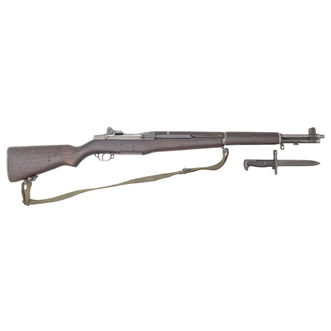 **International Harvester M1 Garand: **International Harvester M1 Garand .30-06. 24" barrel length. SN: 4557001. Parkerized metal finish with walnut semi-pistol grip stock mounting T105 pattern rear aperture and front blade sights with p