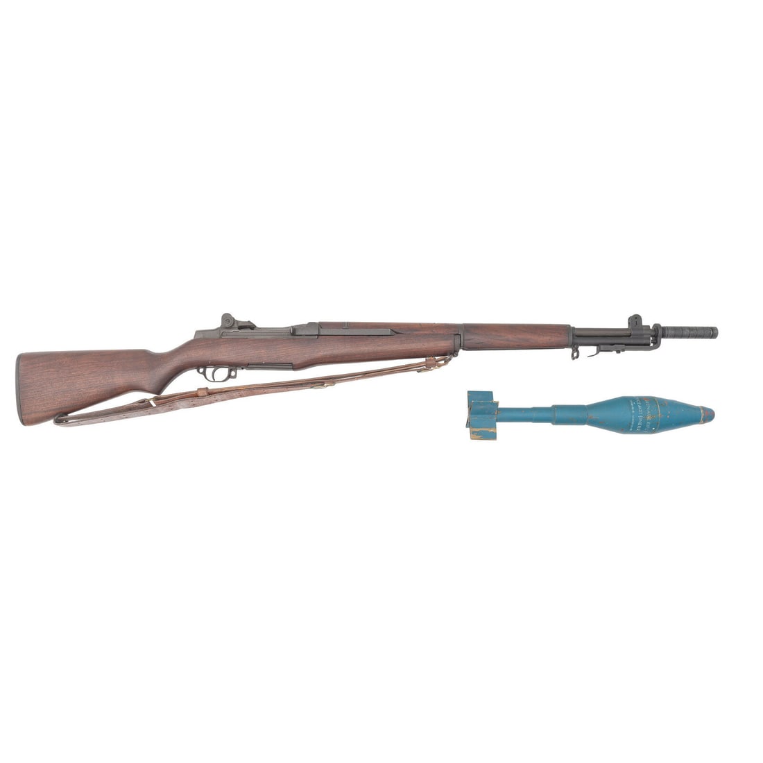 **Springfield Armory M1 Garand with Grenade Launcher and Inert Training Grenade: **Springfield Armory M1 Garand with Grenade Launcher and Inert Training Grenade .30-06. 24" barrel length. SN: 397242. Parkerized metal finish with semi pistol grip walnut stock and full length upper