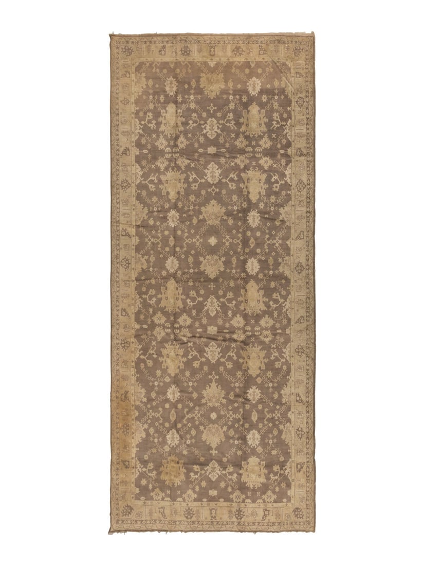 An Oushak Carpet: An Oushak Carpet West Anatolia, Late 19th Century 24 feet 2 inches x 11 feet 11 inches. Property from a Private Family Trust This lot is located in Chicago.