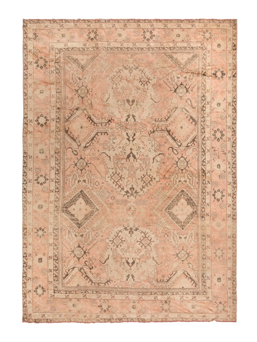 An Oushak Carpet: An Oushak Carpet West Anatolia, Late 19th Century 19 feet 4 inches x 12 feet 8 inches. Property from a Private Family Trust This lot is located in Chicago.