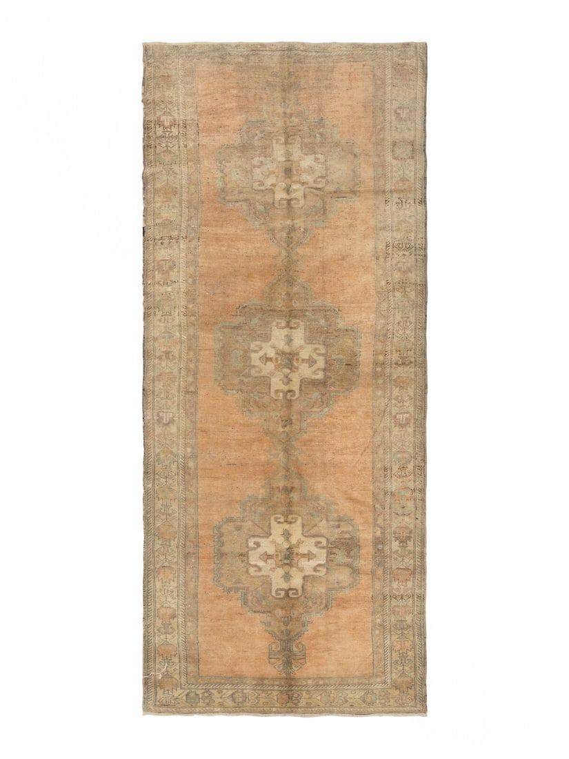 A Khotan Corridor Rug: A Khotan Corridor Rug 20th Century 11 feet 11 inches x 4 feet 10 inches. Property from a Private Family Trust This lot is located in Chicago.