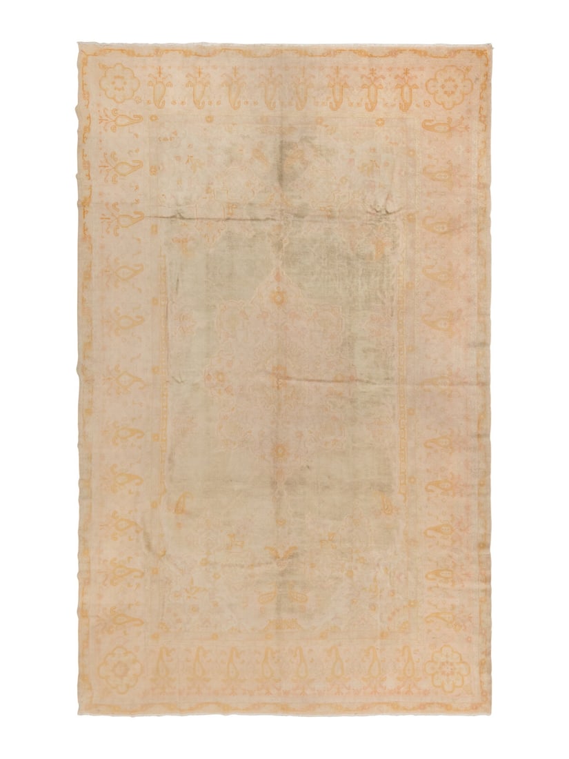 An Oushak Carpet: An Oushak Carpet West Anatolia, Late 19th Century 17 feet 4 inches x 11 feet 1 inch. Property from a Private Family Trust This lot is located in Chicago.