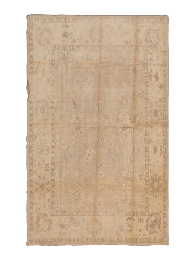 An Oushak Carpet: An Oushak Carpet West Anatolia, Late 19th Century 12 feet 6 inches x 8 feet 8 inches. Property from a Private Family Trust This lot is located in Chicago.
