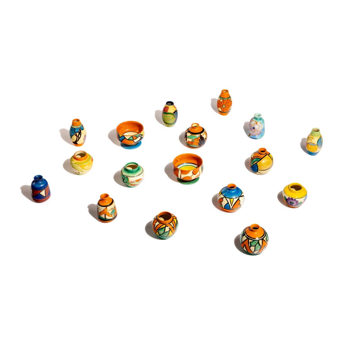 Clarice Cliff (English, 1899-1972) Group of 17 Small Items: Clarice Cliff (English, 1899-1972) Group of 17 Small Items glazed ceramic with manufacturer's mark to undersides largest: 2 1/8 h x 3 1/8 dia inches. Property from the Collection of Richard B. Kutner