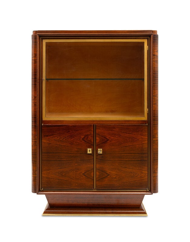 A French Art Deco Gilt Bronze Mounted Rosewood Cabinet: A French Art Deco Gilt Bronze Mounted Rosewood Cabinet Style of Christian Krass (French, 1868-1957), Second Quarter 20th Century with two keys, the upper compartment with a glass medial shelf Heigh