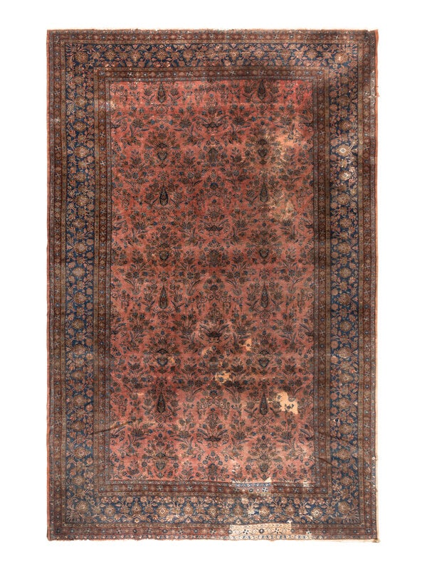 A Sarouk Carpet: A Sarouk Carpet Circa 1920 17 feet 3 inches x 10 feet 5 inches. Property from a Private Family Trust This lot is located in Chicago. ConditionSeveral large patched areas. Areas of worn pile showing