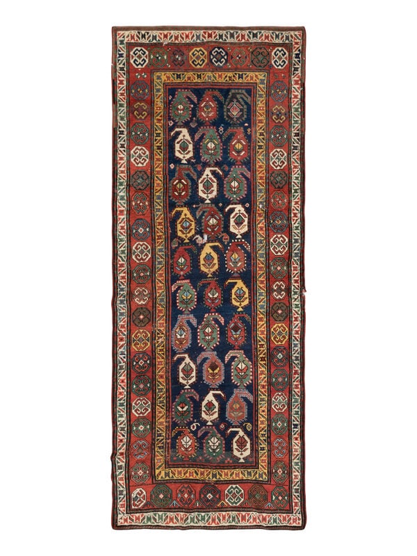 A Genje Rug: A Genje Rug 8 feet 1 inch x 3 feet 8 inches. Property from a Private Family Trust This lot is located in Chicago. ConditionThree holes from moth damage.