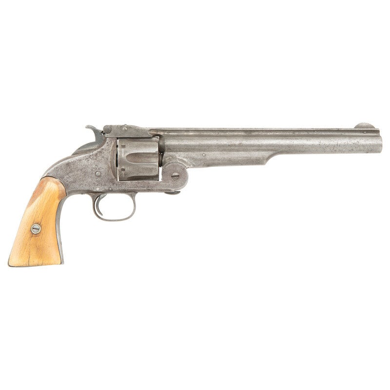 Smith & Wesson No3 American Revolver: Smith & Wesson No3 American Revolver .44 S&W American. 8" ribbed barrel. SN: 8958. No finish, old bone grips. Single action break open simultaneous extraction revolver with notch rear sight in