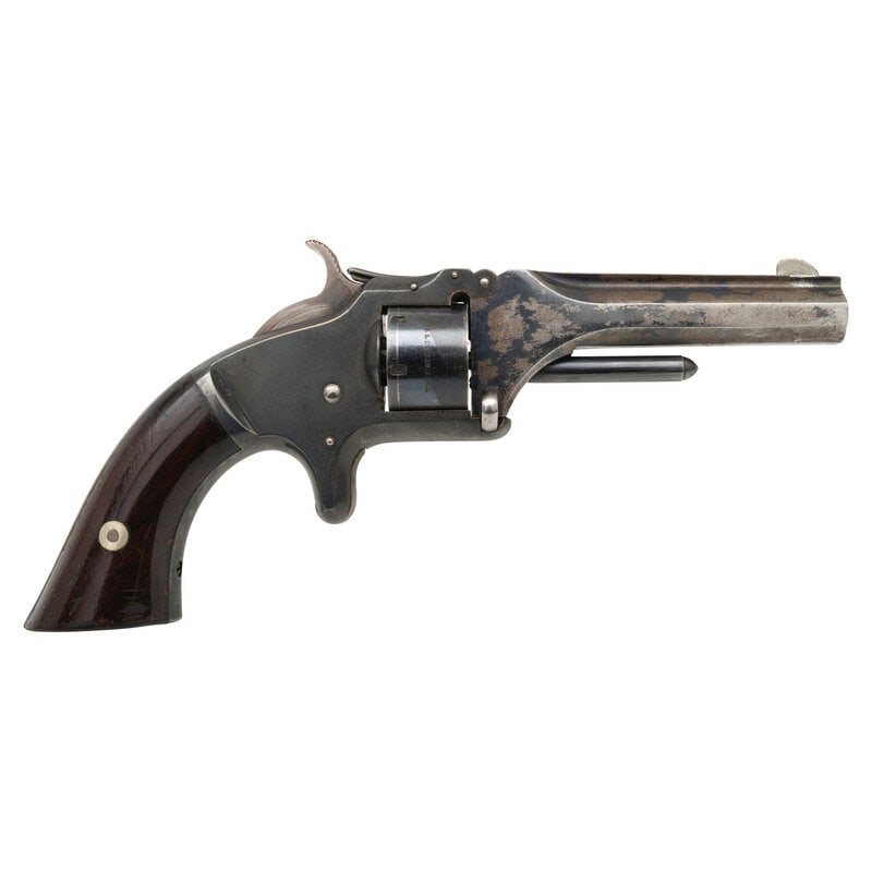 Smith & Wesson Model No 1 2nd Issue Revolver: Smith & Wesson Model No 1 2nd Issue Revolver .22 Rimfire. 3.125" barrel length. SN: 59955. Blued finish with casehardened hammer and silver finished frame mounting varnished Rosewood grips with Ge
