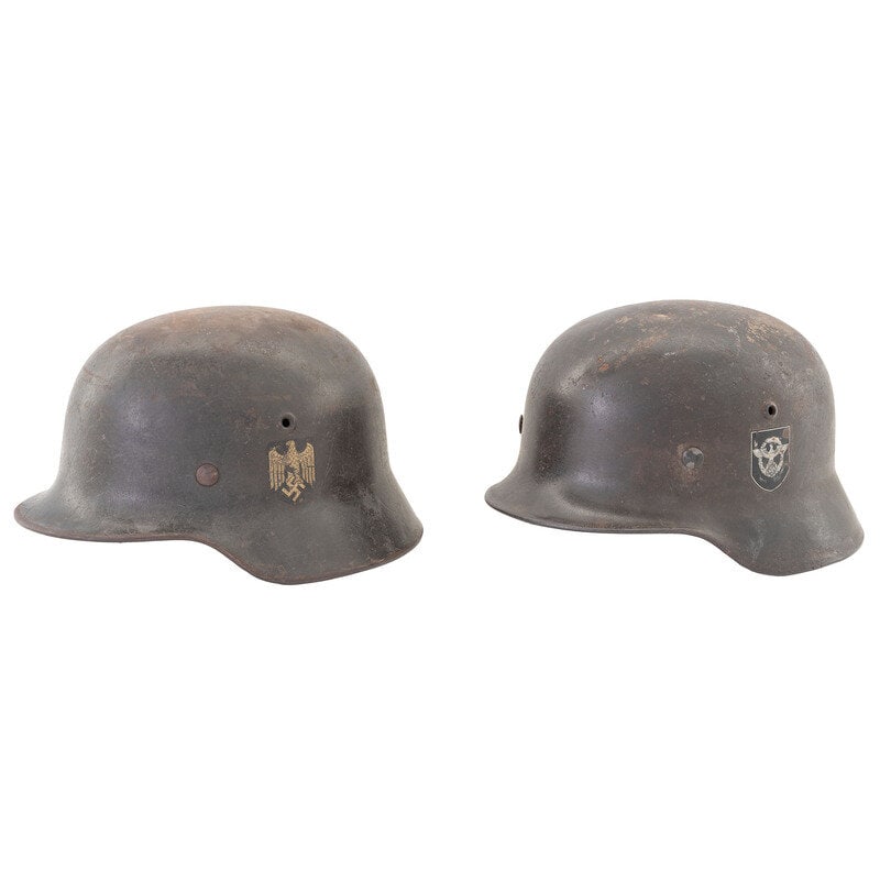 Lot of two WWII German M35 Stahlhelm: Lot of two WWII German M35 Stahlhelm 1.) WW2-era German M35 Stahlhelm. Marked 797 on rear inner and ET64 on inner left. Includes liner. Marked with {Aged Eagle Swastika decal} on outer left. 2.)