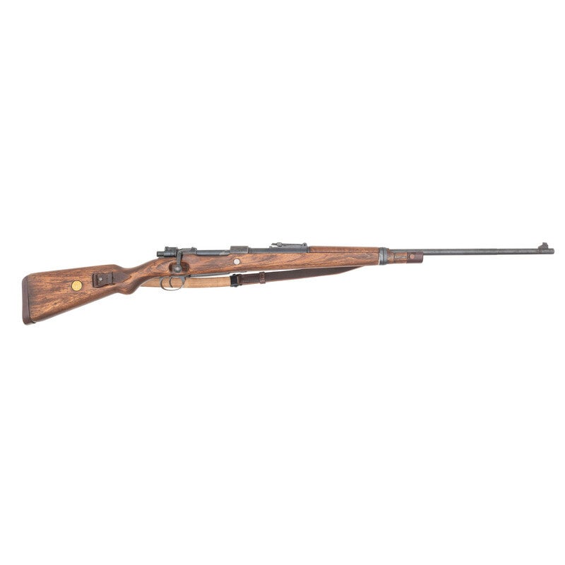 **Sporterized Mauser 98 Rifle: **Sporterized Mauser 98 Rifle 8mm Mauser. 30" barrel. SN: 1139a. Reblued finish, modified laminated stock. Bolt action internal magazine fed rifle with military ladder rear sight, front sight blade