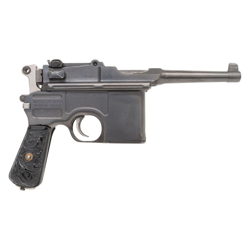 **C96 Bolo Mauser Pistol in 9mm: **C96 Bolo Mauser Pistol in 9mm 9mm Para. 4" barrel length. SN: 575491. Blued finish with straw colored and Nitre blued small parts mounting foliate pattern hardrubber grips with lanyard lop to butt.
