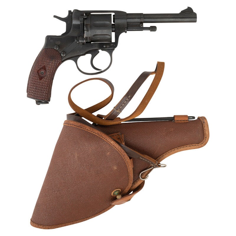 **Soviet Nagant M1895 Revolver Dated 1944 with Holster: **Soviet Nagant M1895 Revolver Dated 1944 with Holster 7.62x38mmR. 4.5" barrel length. SN: 01450. Blued metal arsenal refinish mounting checkered Bakelite grips and standard military pattern sights. D