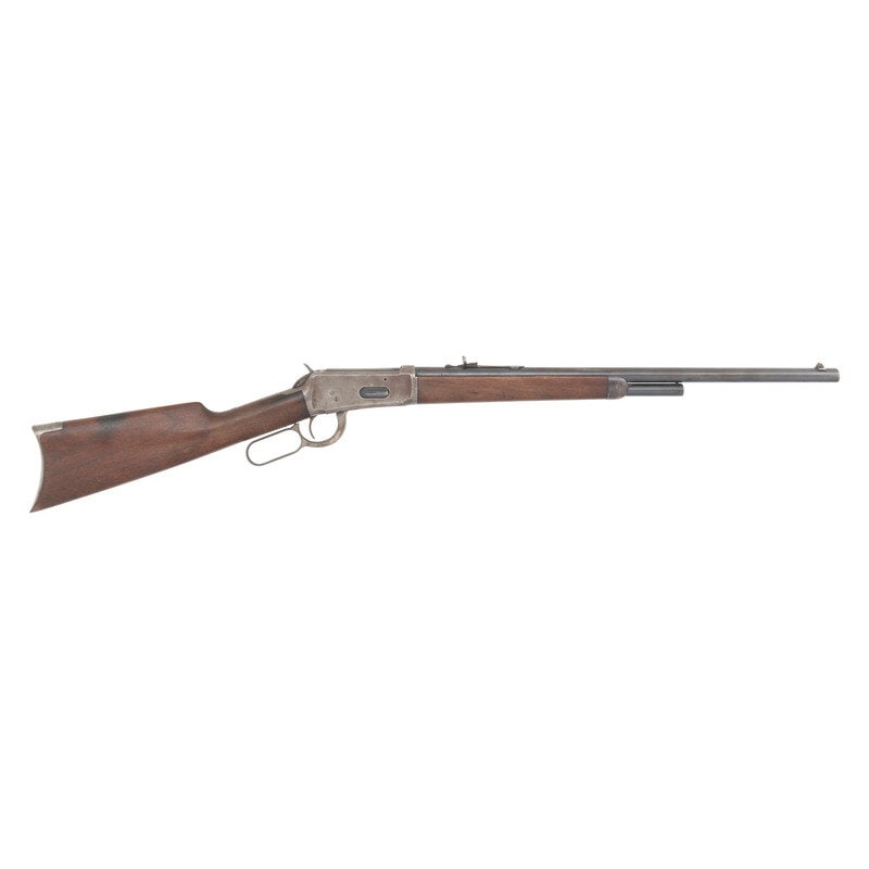 **Winchester 1894 Rifle: **Winchester 1894 Rifle .32-40. 21.5" barrel length. SN: 465249. Case hardened receiver with blued barrel mounting wood straight stock and forend with semi buckhorn rear and front blade sight. Lever a