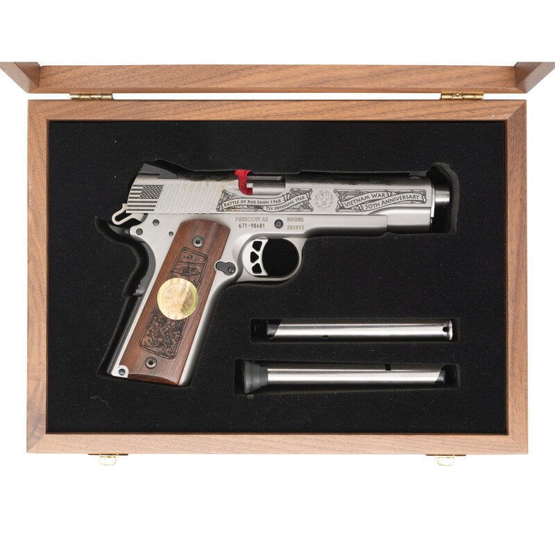 *Ruger Vietnam War 50th Anniversary Commemorative in Box: *Ruger Vietnam War 50th Anniversary Commemorative in Box .45 ACP. 5" barrel length. SN: 671-89481. Bead blasted stainless steel finish with oxide finished small parts and machine engraved wood grips