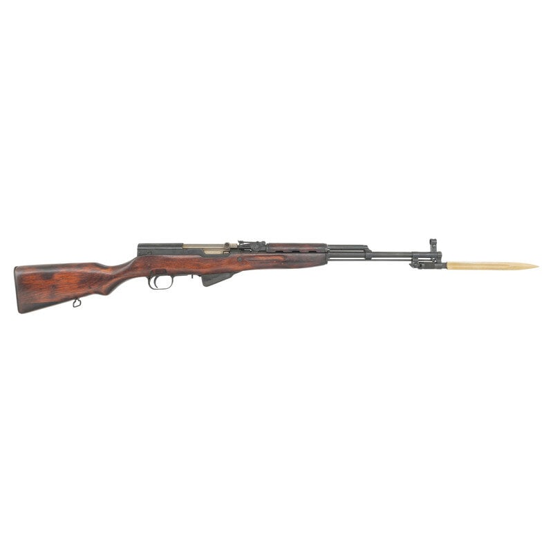 **Soviet SKS Rifle: **Soviet SKS Rifle 7.62x39. 20.5" barrel length. SN: BK4961. Blued metal finish with polished bolt fitted with lacquered birchwood semi pistol grip stock. Short stroke piston gas operated repeating