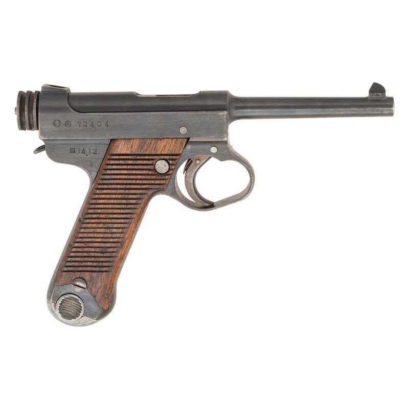**Nambu Type 14 Pistol: **Nambu Type 14 Pistol 8x22mm. 4.61" barrel length. SN: 72404. Blued metal finish with straw colored small parts, polished bolt and internals, and horizontally serrated wood grips. Short recoil