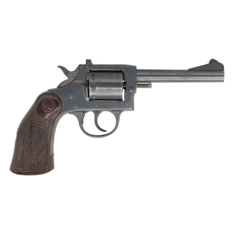 **Iver Johnson #57 Target Revolver: **Iver Johnson #57 Target Revolver .22 LR. 4.875" barrel length. SN: J11147. Blued and casehardened metal finish with one piece checkered Bakelite grips featuring {Owlhead} logo to right side and