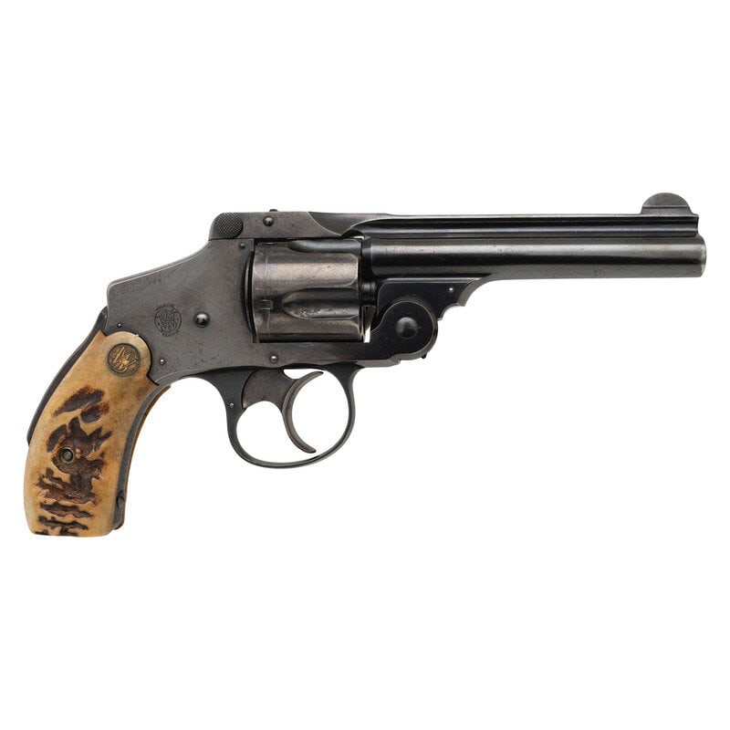 **Smith & Wesson 5th Model Safety Hammerless .38 S&W: **Smith & Wesson 5th Model Safety Hammerless .38 S&W .38 S&W. 4" barrel. SN: 237289. Blued metal finish with casehardened trigger mounting Smith & Wesson medallion staghorn grips, and