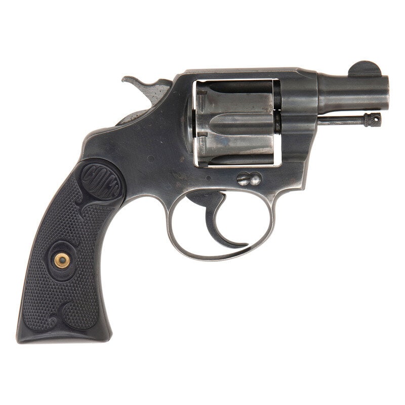 **Colt Police Positive .38 Revolver : **Colt Police Positive .38 Revolver .38 Colt. 1.875" barrel length. SN: 29510. (Mfg. ca 1909). Blued metal finish with polished hammer flanks mounting checkered COLT logo hardrubber grips. Double a