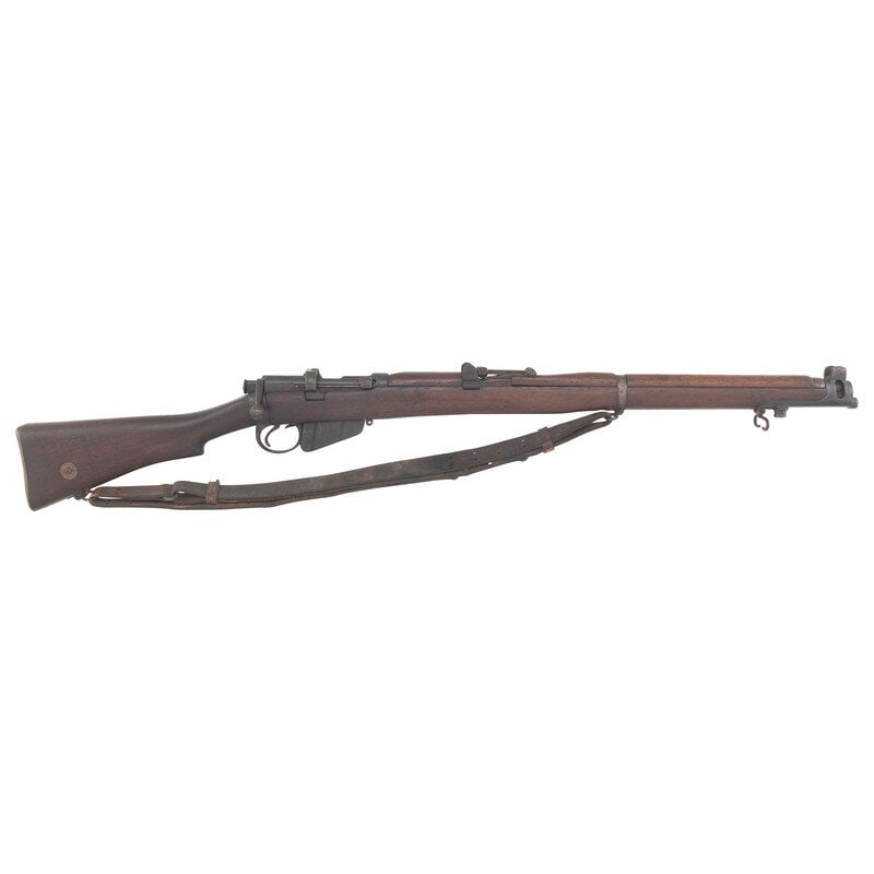 **Lee Enfield No.1 MkIII*: **Lee Enfield No.1 MkIII* .303. 25.2" barrel length. SN: 7800. Blued metal finish overall mounting walnut semi pistol grip stock with full length upper handguard mounting standard tangent rear notch a