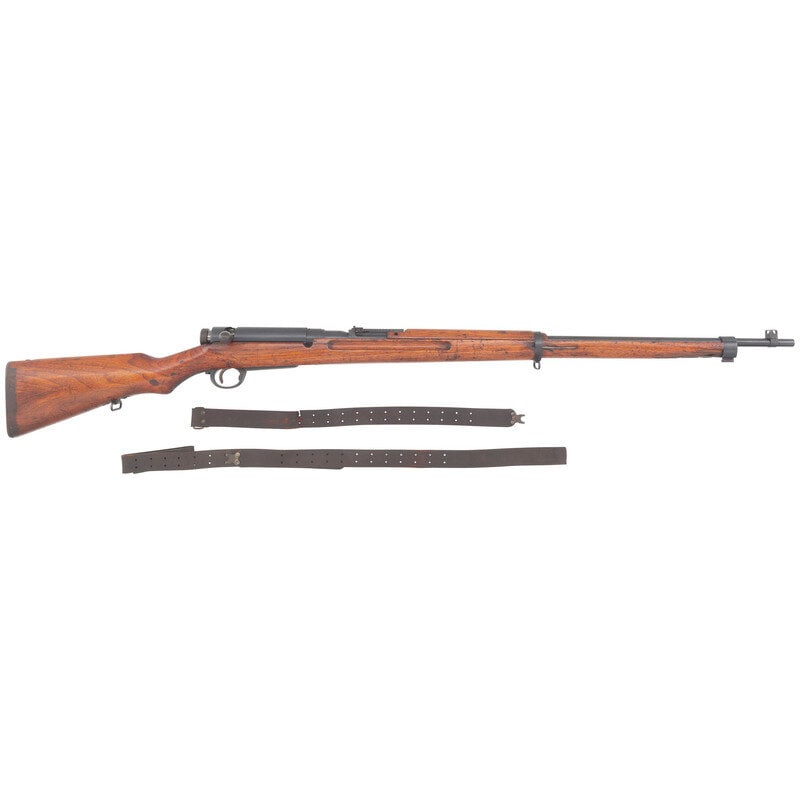 **Japanese Type 38 Arisaka Rifle: **Japanese Type 38 Arisaka Rifle 7.7x58mm. 31.4" barrel length. SN: 39908. Blued metal finish with wood semi-pistol grip stock featuring spliced toe and front and rear sling loops. Bolt action interna