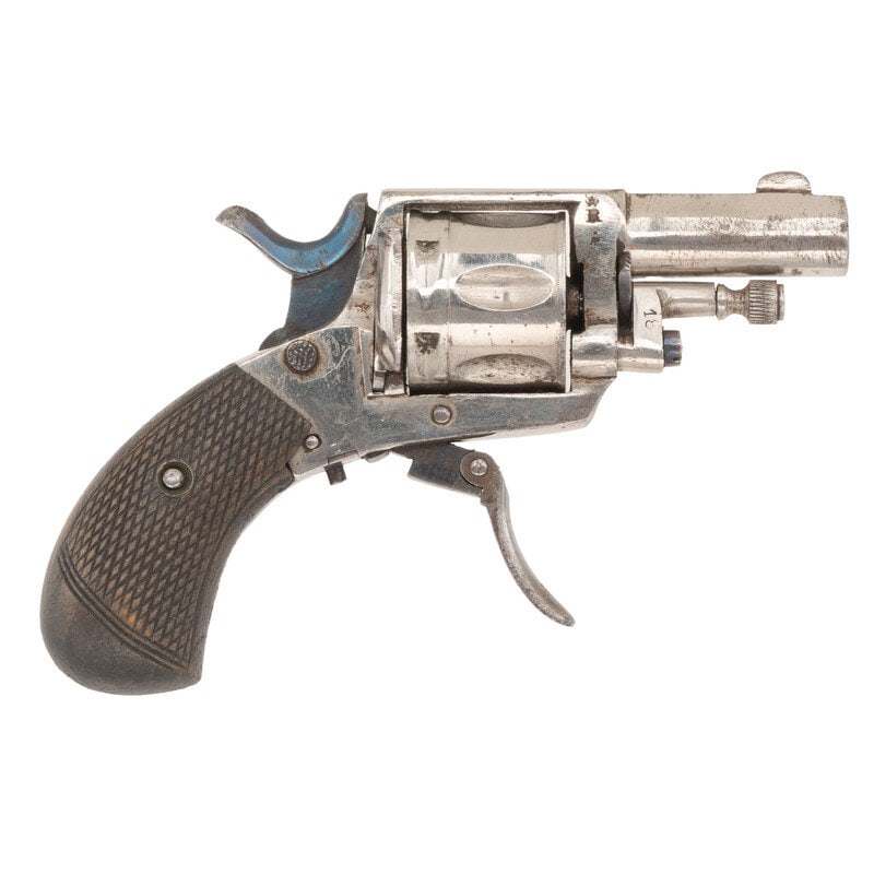 **Belgian Folding Trigger Revolver: **Belgian Folding Trigger Revolver .32 Centerfire. 1.875" barrel length. SN: NSN (Assembly Number 18). Nickel plated finish with blued small parts mounting checkered walnut birdshead grips, knurled sa
