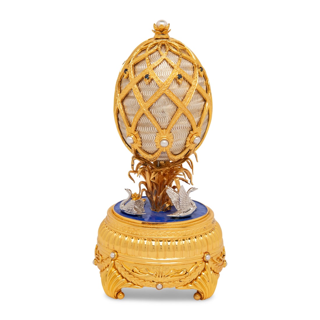 A Silver, Gilt and Enamel Decorated Swan Lake Egg-Form Music Box (1 of 5)