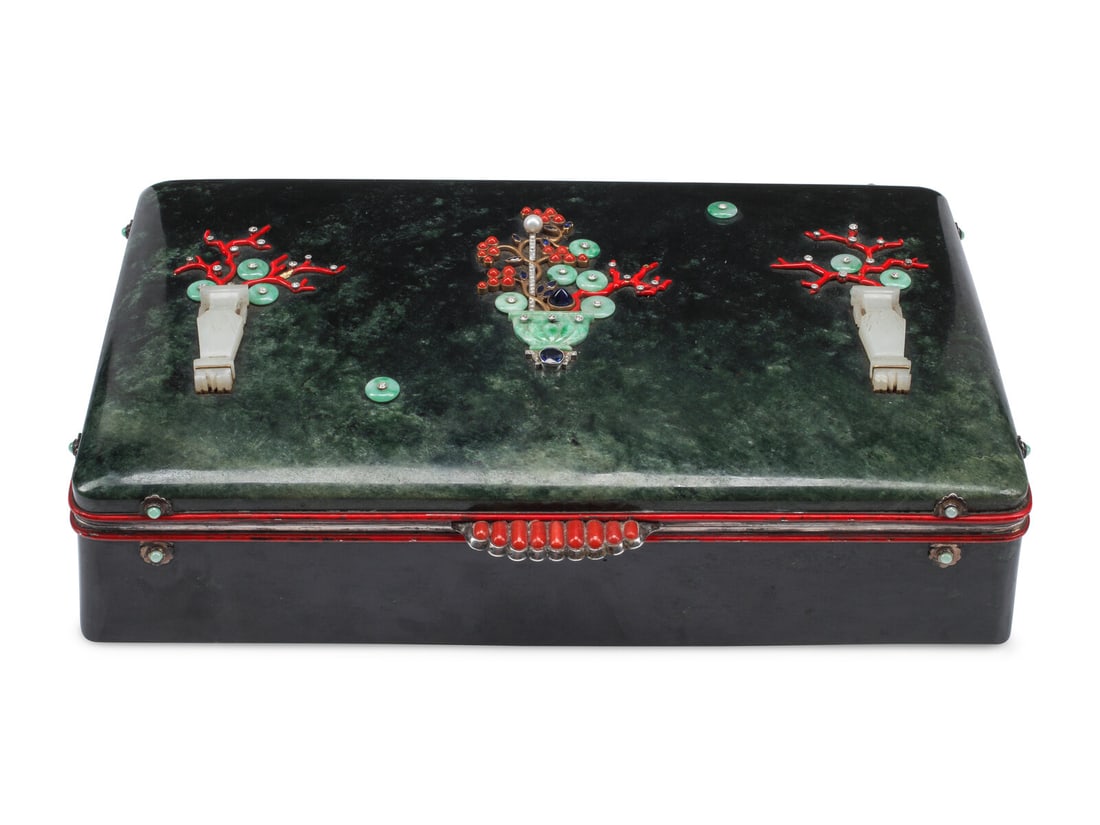 A Large Nephrite Box with Diamond, Coral and Sapphire Inlay: A Large Nephrite Box with Diamond, Coral and Sapphire Inlay Early 20th Century having a compartmented interior. Height 2 1/2 x width 11 x depth 7 inches. This lot is located in Chicago.