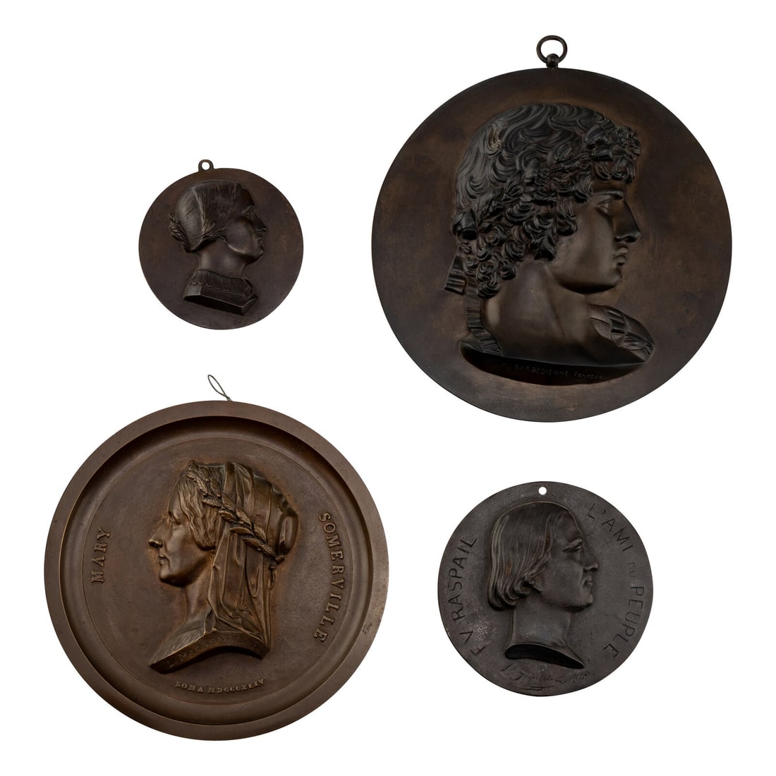 Four Bronze Profile Plaques: Four Bronze Profile Plaques 19th Century comprising examples depicting Antinous cast by F. Barbedienne; Mary Somerville by L. Macdonald F.; Francois Raspail by L. Giradrin; and one depicting an unknow