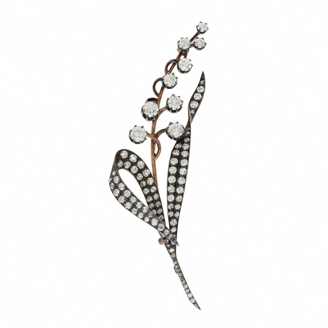VICTORIAN, DIAMOND AND SILVER-TOPPED GOLD LILY OF THE VALLEY BROOCH: VICTORIAN, DIAMOND AND SILVER-TOPPED GOLD LILY OF THE VALLEY BROOCH Designed as a lily of the valley flower and set with old European, old mine, and single cut diamonds weighing approximately 4.00 -