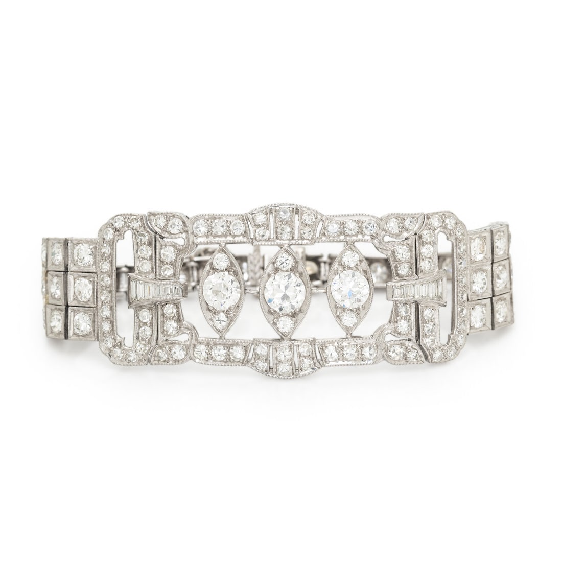 DIAMOND AND PLATINUM BRACELET: DIAMOND AND PLATINUM BRACELET Designed with a plaque with openwork and marquise-shaped motifs, set throughout with transitional, old European, baguette, and single cut diamonds weighing approximately