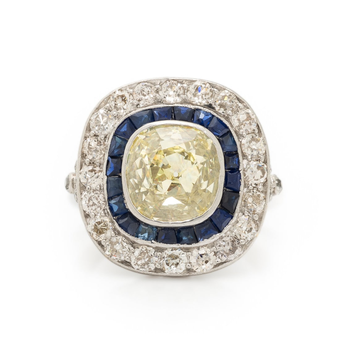 ART DECO, YELLOW DIAMOND, SAPPHIRE, AND DIAMOND RING: ART DECO, YELLOW DIAMOND, SAPPHIRE, AND DIAMOND RING Centered by an antique cushion cut yellow diamond (origin of color not tested) weighing approximately 2.40 - 2.80 carats by formula, with