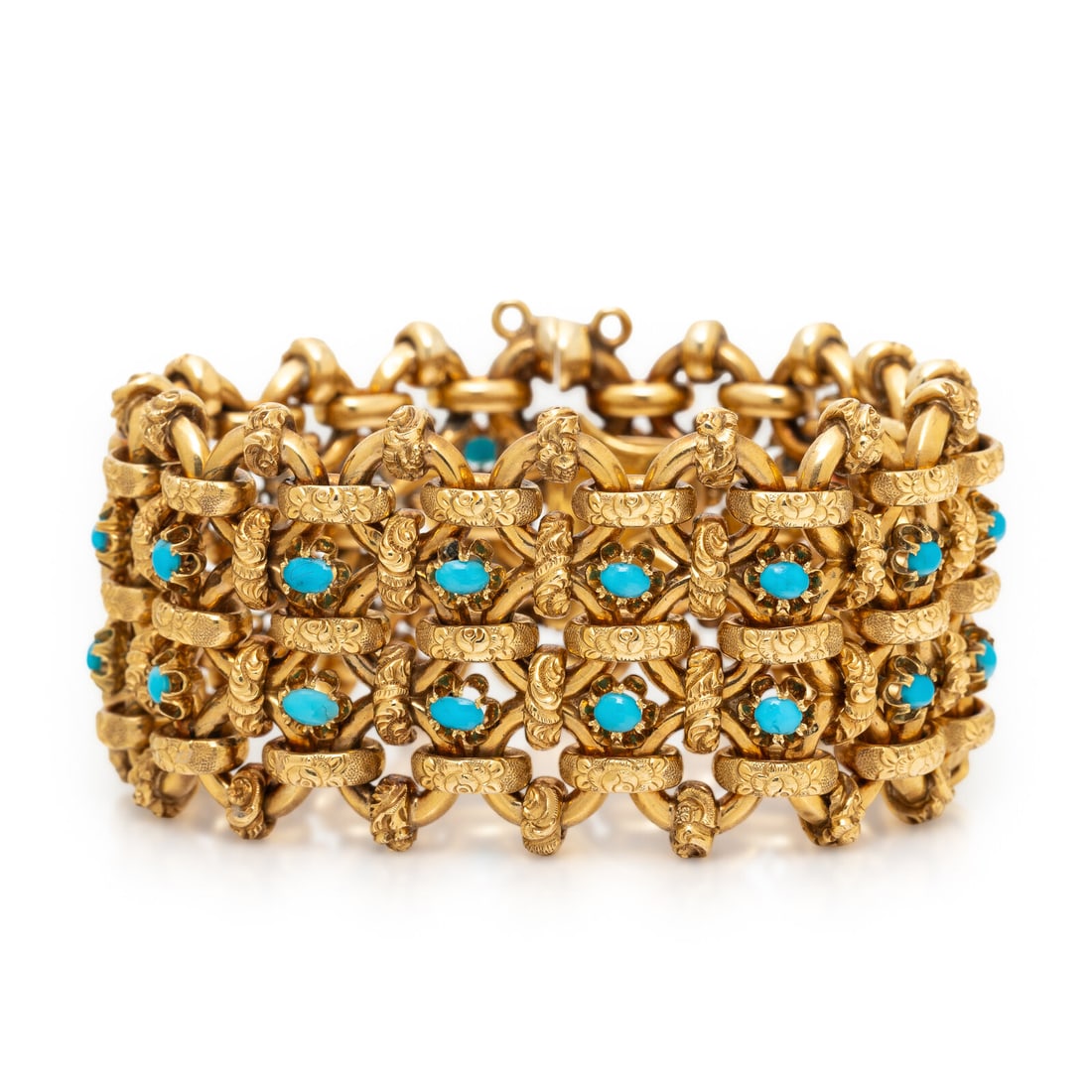 FRENCH, TURQUOISE AND YELLOW GOLD BRACELET: FRENCH, TURQUOISE AND YELLOW GOLD BRACELET In a fancy link design with floral embellishment, set with oval cabochon turquoise. Mounted in 18 karat yellow gold. 7 1/4 inches long, 1 1/4 inches wide.
