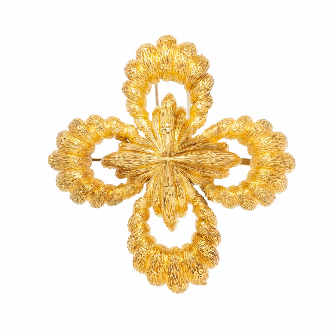 YELLOW GOLD QUATREFOIL PENDANT BROOCH: YELLOW GOLD QUATREFOIL PENDANT BROOCH In a textured quatrefoil design. Yellow gold. 3 x 3 inches. Stamp: (obscured). Gross weight: 43.80 dwt. Property from the Estate of Mary Edson Smith, Palm Beach