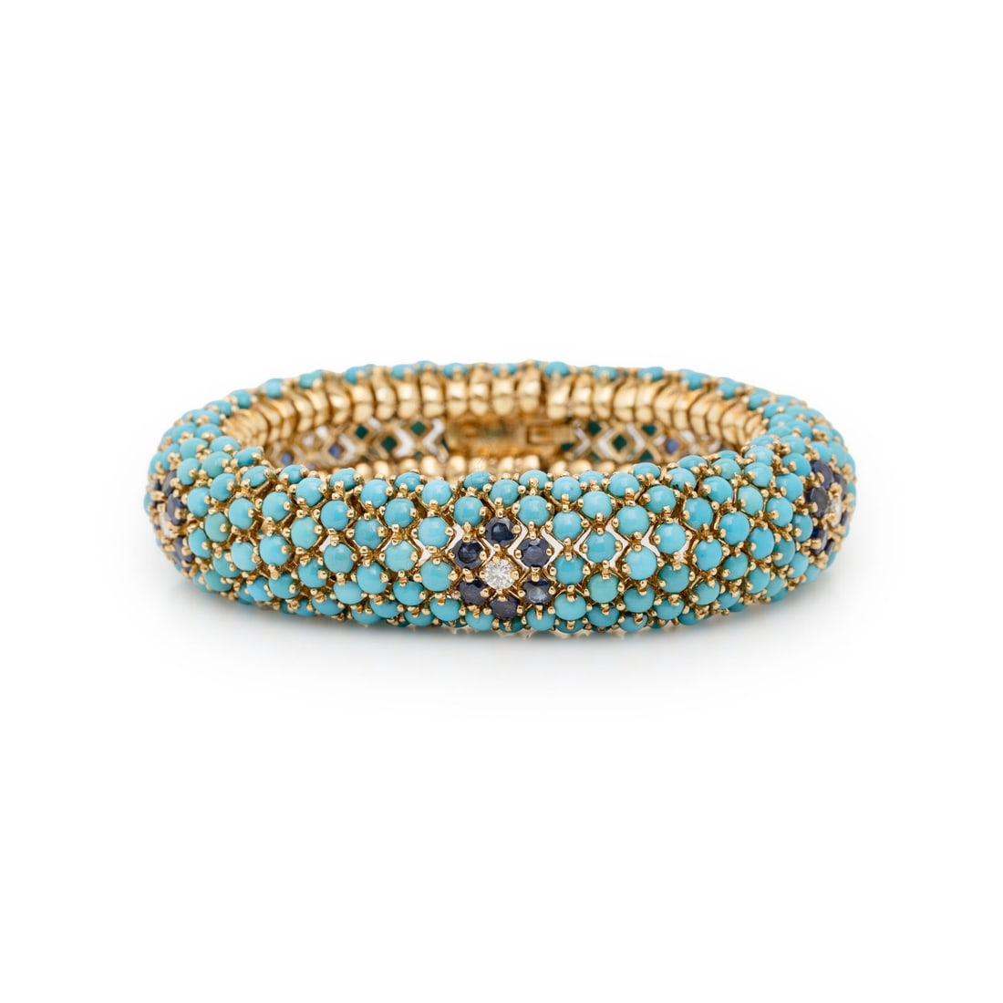 HAMMERMAN BROTHERS, YELLOW GOLD, TURQUOISE, SAPPHIRE AND DIAMOND BRACELET: HAMMERMAN BROTHERS, YELLOW GOLD, TURQUOISE, SAPPHIRE AND DIAMOND BRACELET In a floral motif with semi-flexible links, set with round cabochon turquoise, round sapphires, and round diamonds weighing