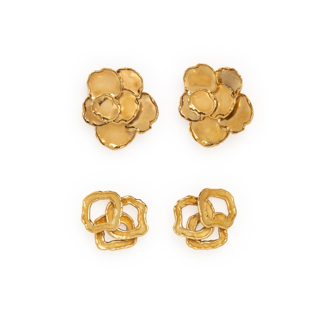 CHAUMET, TWO PAIRS OF YELLOW GOLD EARRINGS: CHAUMET, TWO PAIRS OF YELLOW GOLD EARRINGS Including two pairs of earrings in abstract floral designs. 18 karat yellow gold. 1 1/4 and 1 1/2 inches long. Stamp: CHAUMET PARIS (Chaumet maker's mark)