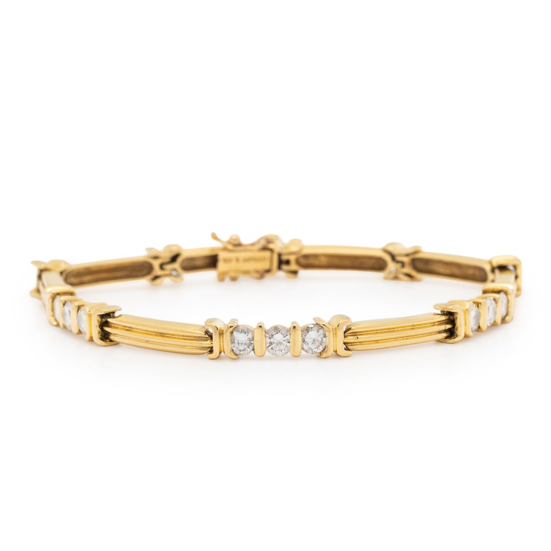 TIFFANY & CO., YELLOW GOLD AND DIAMOND BRACELET: TIFFANY & CO., YELLOW GOLD AND DIAMOND BRACELET In a stylized bar link design, set with round diamonds weighing approximately 1.60 carats total. Mounted in 18 karat yellow gold. 6 3/4 inches