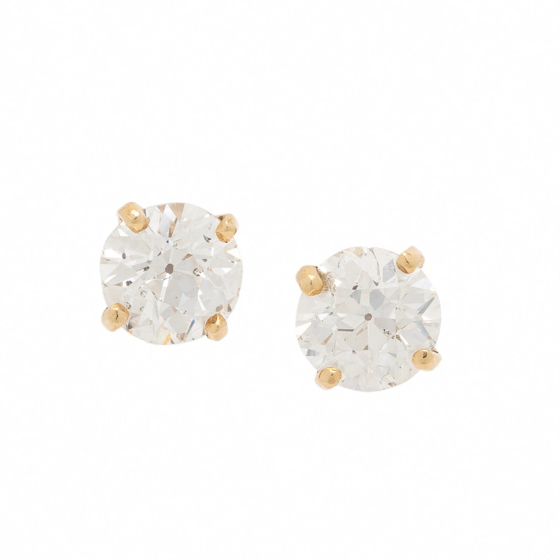 DIAMOND STUD EARRINGS: DIAMOND STUD EARRINGS Set with old European cut diamonds weighing approximately 1.70 and 1.80 carats respectively by formula. Mounted in yellow gold. 1/4 inch long. Gross weight: 1.60 dwt. Property