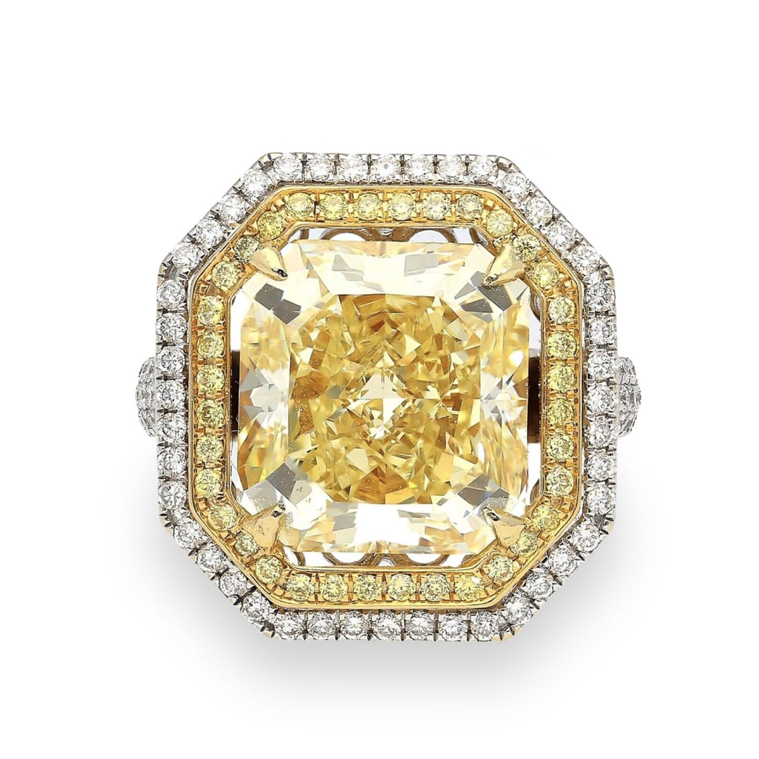 10.88 CARAT FANCY YELLOW DIAMOND AND DIAMOND RING: 10.88 CARAT FANCY YELLOW DIAMOND AND DIAMOND RING Featuring a cut-cornered rectangular modified brilliant cut Natural Fancy Yellow diamond weighing 10.88 carats, set in a double halo of round yellow