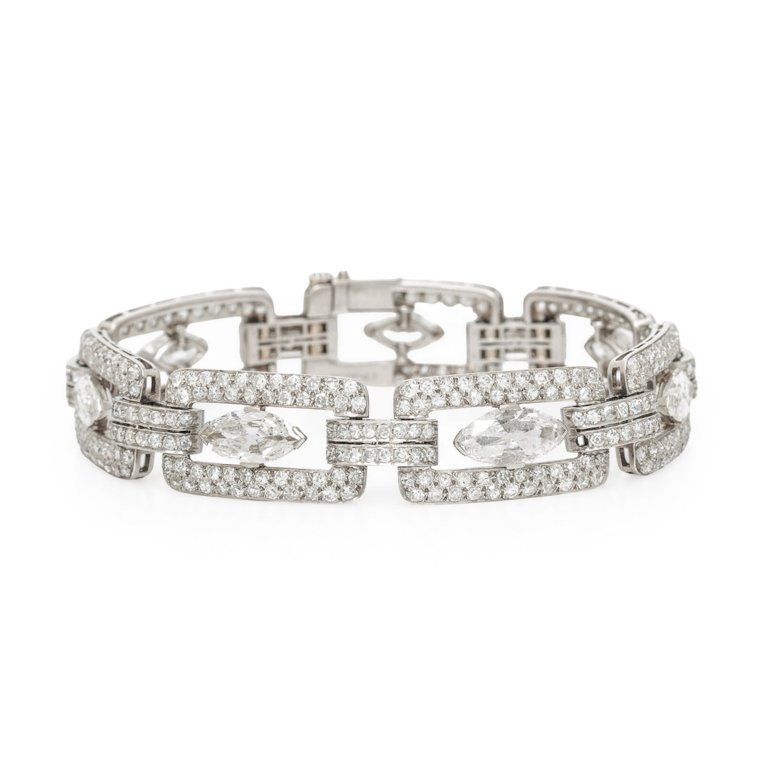CHARLTON & CO., ART DECO, DIAMOND AND PLATINUM BRACELET: CHARLTON & CO., ART DECO, DIAMOND AND PLATINUM BRACELET Designed with rectangular links, featuring seven marquise cut diamonds weighing approximately 6.50 - 7.00 carats total, framed by single cut