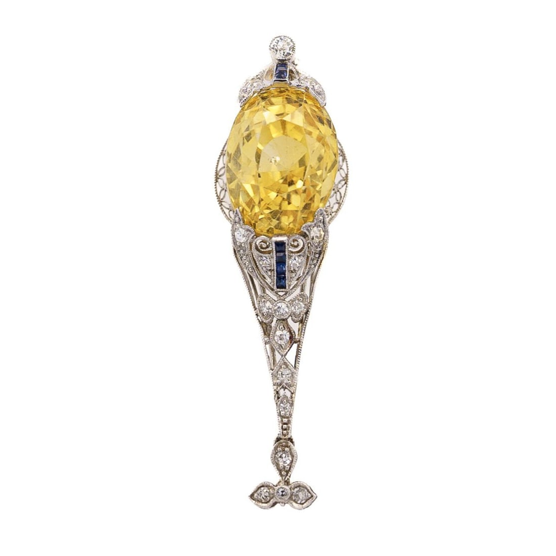 EDWARDIAN YELLOW SAPPHIRE, DIAMOND, AND SAPPHIRE PENDANT: EDWARDIAN YELLOW SAPPHIRE, DIAMOND, AND SAPPHIRE PENDANT Featuring an oval yellow sapphire measuring approximately 20.00 carats by formula mounted in a filigree setting with calibré-cut