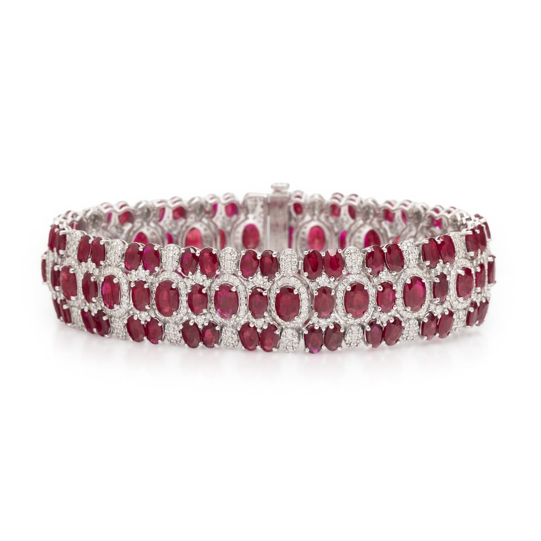 BURMESE RUBY AND DIAMOND BRACELET: BURMESE RUBY AND DIAMOND BRACELET Designed with flexible links and set throughout with oval rubies weighing approximately 32.99 carats total and round diamonds weighing approximately 4.55 carats