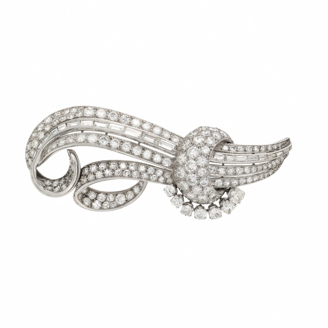 PLATINUM AND DIAMOND SPRAY BROOCH: PLATINUM AND DIAMOND SPRAY BROOCH In a ribbon design, set throughout with swirls of old European, transitional, single, and baguette cut diamonds weighing approximately 7.45 carats total. Mounted in