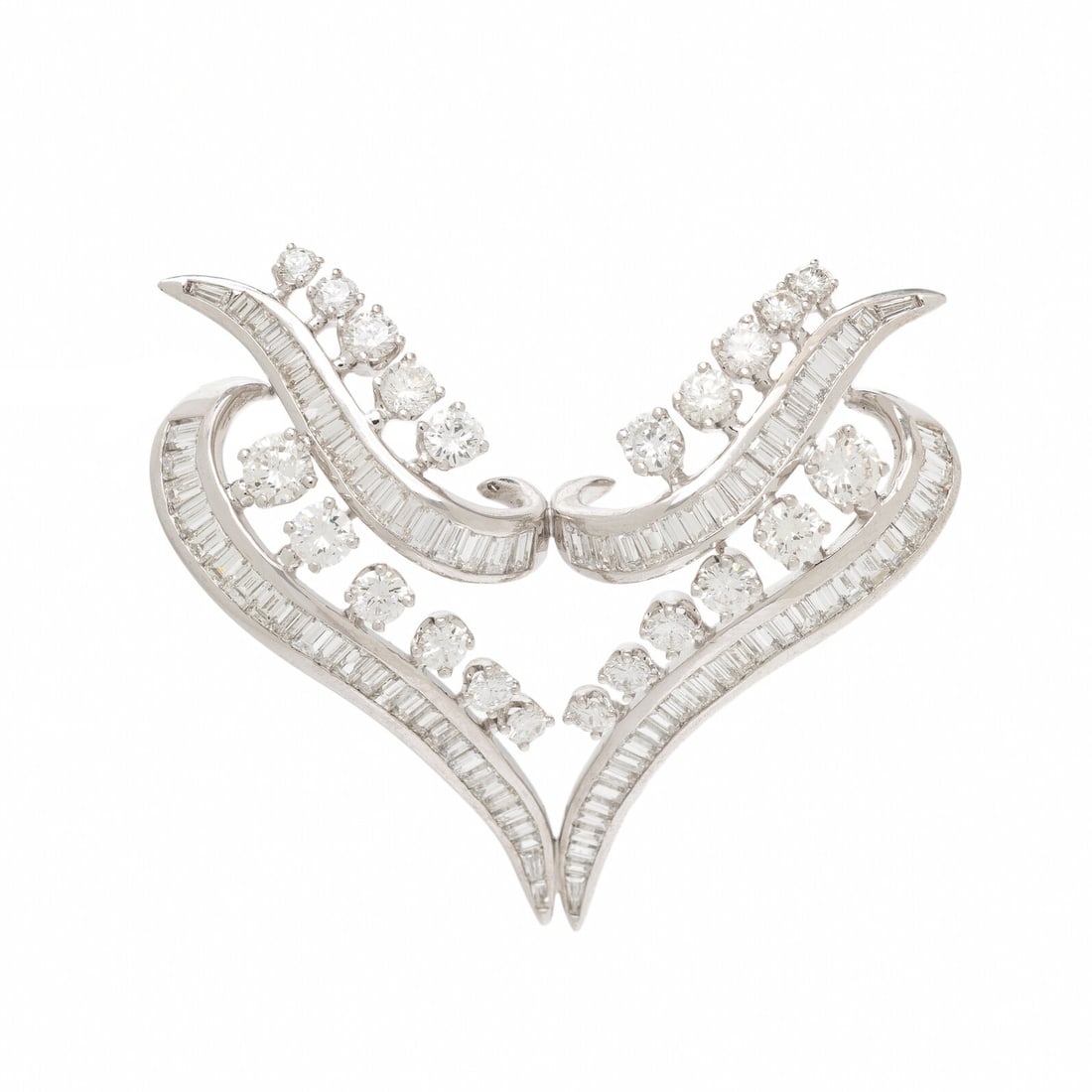 DIAMOND AND PLATINUM BROOCH: DIAMOND AND PLATINUM BROOCH In an abstract design, set with round and baguette diamonds weighing approximately 7.30 carats total. Mounted in platinum. 1 1/2 x 2 inches. Gross weight: 13.70 dwt. This