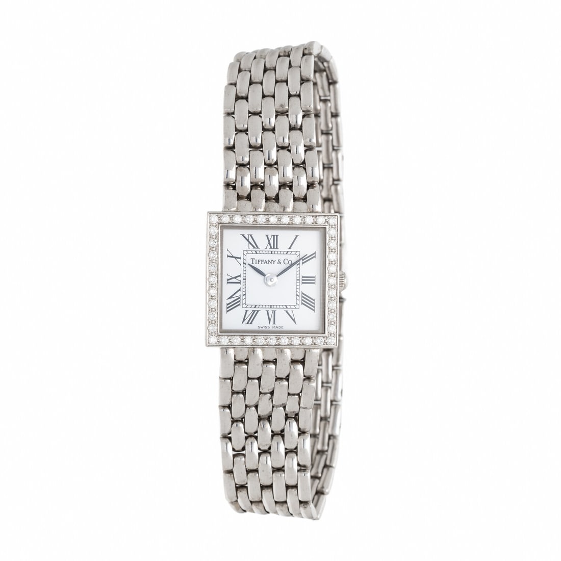 TIFFANY & CO., WHITE GOLD WATCH WITH DIAMOND BEZEL: TIFFANY & CO., WHITE GOLD WATCH WITH DIAMOND BEZEL Maker: Tiffany & Co. Serial number: 940591666 Case size: Approx. 19 mm Case material: White gold Bezel: Diamonds Dial: White Movement: Quartz