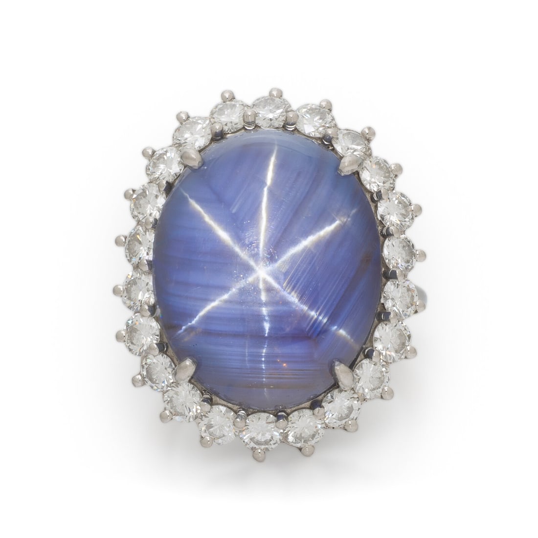 STAR SAPPHIRE, DIAMOND, AND PLATINUM RING: STAR SAPPHIRE, DIAMOND, AND PLATINUM RING Featuring an oval double cabochon star sapphire weighing approximately 31.00 carats by formula, accented by round diamonds weighing approximately 1.35 carats