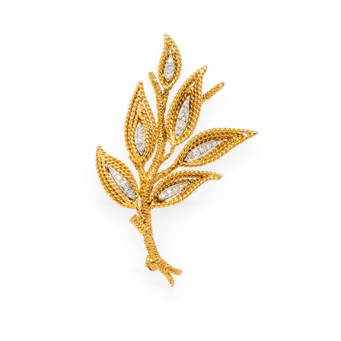 STERLÉ, YELLOW GOLD AND DIAMOND BROOCH: STERLÉ, YELLOW GOLD AND DIAMOND BROOCH Designed as a branch with leaves, set with single cut diamonds weighing approximately 0.45 carat total. Mounted in 18 karat yellow and white gold. 2 1/4 x